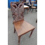 19TH CENTURY OAK HALL CHAIR WITH DECORATIVE CARVED TWIN EAGLE BACK ON TURNED SUPPORTS