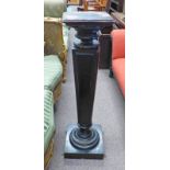 EBONISED PLANT STAND ON PLINTH BASE.