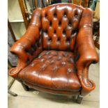 OVERSTUFFED RED LEATHER BUTTON BACK ARMCHAIR ON SQUARE SUPPORTS