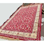 RED GROUND FULL PILE KASHMIR RUG WITH ALL OVER FLORAL PATTERN WITH GOLD BORDER 227 X 155CM