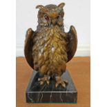 BRONZE MODEL OF A STANDING OWL ON A BLACK MARBLE BASE WITH MONOGRAM TO REVERSE - 15.