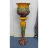 ART POTTERY FLOWER POT ON STAND.