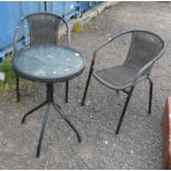 CIRCULAR GARDEN TABLE WITH GLASS TOP AND PAIR OF ARMCHAIRS.