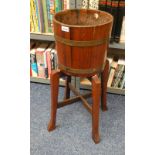 OAK BARREL JARDINIERE WITH BRASS BANDING ON BASE WITH 4 SHAPED SUPPORTS,