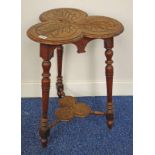 ARTS & CRAFTS STYLE OAK TABLE WITH SHAPED TOP & CARVED DECORATION ON TURNED SUPPORTS,