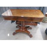 19TH CENTURY ROSEWOOD FLIP TOP GAMES TABLE ON CENTRE PEDESTAL WITH 3 SPREADING PAW FEET 74CM TALL X