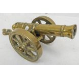 BRASS TABLE TOP CANNON WITH SEVERAL MARKINGS TO INCLUDE "1812" STAR AND A FLAMING BOMB,