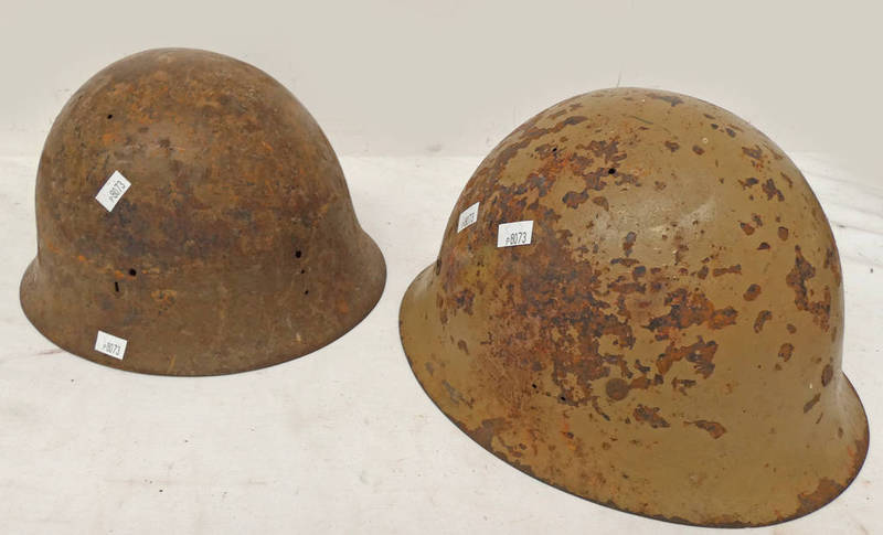 TWO WW2 ERA JAPANESE HELMETS ONE WITH YELLOW CHARACTER MARKS TO THE INTERIOR ,