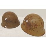 TWO WW2 ERA JAPANESE HELMETS ONE WITH YELLOW CHARACTER MARKS TO THE INTERIOR ,