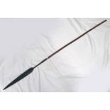 TRIBAL SPEAR WITH 56CM LONG HEAD WITH 41CM LONG EDGES ON A WOODEN SHAFT,