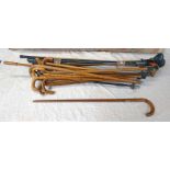 SELECTION OF WALKING STICKS TO INCLUDE A 875 MARKED YELLOW METAL BANDED STICK,