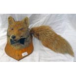 TAXIDERMY STUDY OF A FOX WEARING BOW TIE ON SHIELD WITH TAIL
