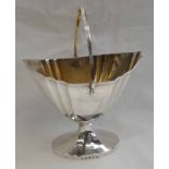 GEORGE III SCOTTISH SILVER SWING HANDLED SWEET MEAT BASKET WITH GILT INTERIOR ON SHAPED OVAL BASE,