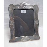 LARGE SILVER PHOTO FRAME DECORATED WITH DAFFODILS BY WILLIAM NEALE ,
