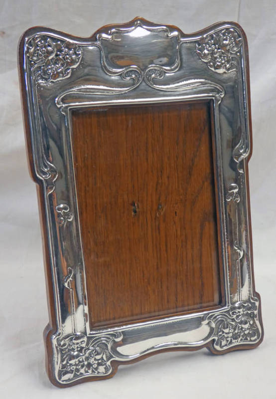 ART NOUVEAU STERLING SILVER PHOTO FRAME WITH STYLISED FLORAL DECORATION & OAK EASEL BACK - 23 CM