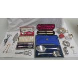 PAIR OF CANDLESNUFFERS, PAIR OF GRAPE SCISSORS, CUT GLASS HANDLED CAKE KNIFE, CASED BUTTER KNIVES,