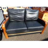 HARDWOOD FRAMED BLACK LEATHER SETTEE Condition Report: The dimensions for this item