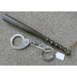 PAIR OF 1960'S HIATTS HANDCUFFS WITH KEY TOGETHER WITH A 1960'S WOODEN TRUNCHEON WITH LEATHER STRAP