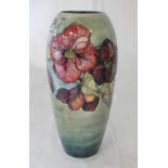 MOORCROFT TAPERING VASE DECORATED WITH FLOWERS INITIALLED IN GREEN - 32.