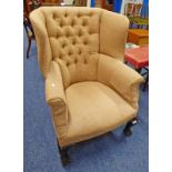 OVERSTUFFED WINGBACK ARMCHAIR ON MAHOGANY BALL AND CLAW SUPPORTS