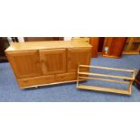 ERCOL ELM SIDEBOARD OF 3 PANEL DOORS OVER 2 DRAWERS AND ERCOL ELM WALL MOUNTED PLATE RACK.