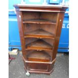 MAHOGANY CORNER CABINET WITH OPEN SHELVES OVER PANEL DOOR ON BRACKET SUPPORTS,