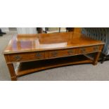 LARGE RECTANGULAR WALNUT COFFEE TABLE WITH 3 DRAWERS EACH SIDE & UNDERSHELF ON SQUARE SUPPORTS.