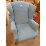 OVERSTUFFED WINGBACK ARMCHAIR ON SQUARE MAHOGANY SUPPORTS