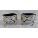 PAIR OF GEORGE III SILVER OVAL SALT CELLARS WITH PIERCED DECORATION ON BALL & CLAW FEET WITH BLUE