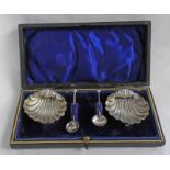 CASED PAIR OF SILVER SHELL SALTS,