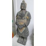 TERRACOTTA STYLE FIGURE OF A CHINESE SOLDIER IN CHARACTERISTIC FORM WITH CROSSED HANDS 96CM TALL