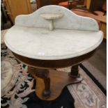 19TH CENTURY HALFMOON MARBLE TOPPED WASHSTAND ON MAHOGANY BASE WITH DECORATIVE CARVED SUPPORTS 86CM