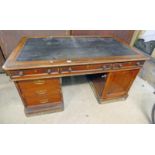 19TH CENTURY MAHOGANY DESK WITH LEATHER INSET TOP, 5 DRAWERS AND PANEL DOOR.