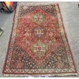 RED GROUND MIDDLE EASTERN RUG 180 CM X 115 CM