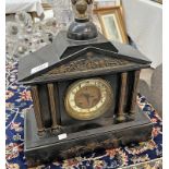 SLATE MANTLE CLOCK WITH METAL PANEL TO FRONT DEPICTING A ANCIENT BATTLE