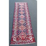 RICH BLUE GROUND IRANIAN RUNNER WITH DIAMOND MEDALLION DESIGN,