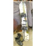 GENERICS SNOWBOARD CO SNOWBOARD MADE IN AUSTRIA AND PAIR OF SNOWBOARDING BOOTS.