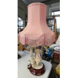 PORCELAIN TABLE LAMP ON MAHOGANY BASE WITH PINK SHADE