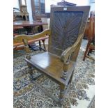 19TH CENTURY OAK HALL CHAIR WITH DECORATIVE CARVED BACK ON TURNED SUPPORTS