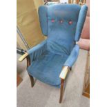 MAHOGANY FRAMED WINGBACK ARMCHAIR ON SABRE SUPPORTS