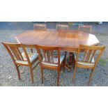 MAHOGANY EXTENDING DINING TABLE WITH OCTAGONAL TOP AND EXTRA LEAF ON TURNED SUPPORTS AND SET OF 6