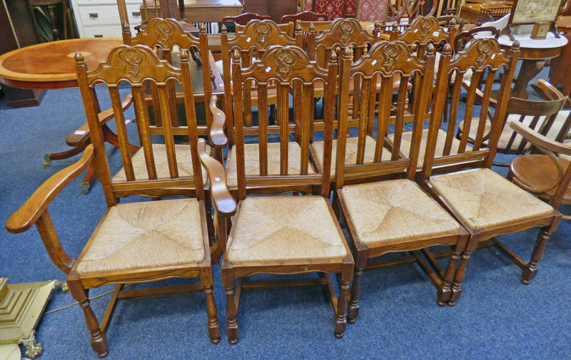 SET OF 8 OAK DINING CHAIRS WITH RUSH SEATS AND DECORATIVE CARVED BACKS ON TURNED SUPPORTS INCLUDING