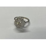 18CT GOLD & PLATINUM DIAMOND CLUSTER RING, THE CENTRAL DIAMOND APPROX. 0.