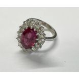 18CT GOLD PINK TOURMALINE & DIAMOND CLUSTER RING, THE OVAL TOURMALINE APPROX. 4.