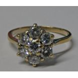 18CT GOLD DIAMOND CLUSTER RING, THE SEVEN BRILLIANT CUT DIAMONDS, APPROX. 1.