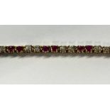 14K GOLD RUBY & DIAMOND SET BRACELET,