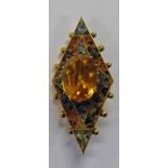 SCOTTISH CITRINE AND GRANITE BROOCH WITH CENTRAL CLAW SET OVAL CUT CITRINE SURROUNDED BY RED AND