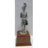 SILVER STATUE OF A 19TH CENTURY MILITARY OFFICER ON A WOODEN PLINTH,