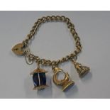 9CT GOLD CURB LINK BRACELET WITH 2 X 9CT GOLD FOB SEALS AND A 9CT GOLD CHARM - 36.