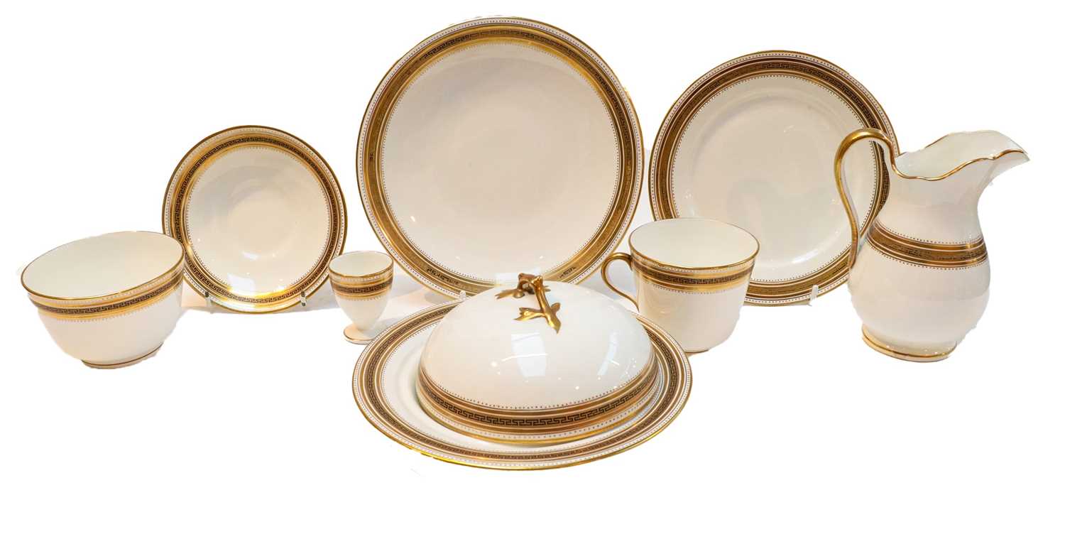 An English porcelain breakfast service for six, including: egg cups, tea cups and saucers, milk,